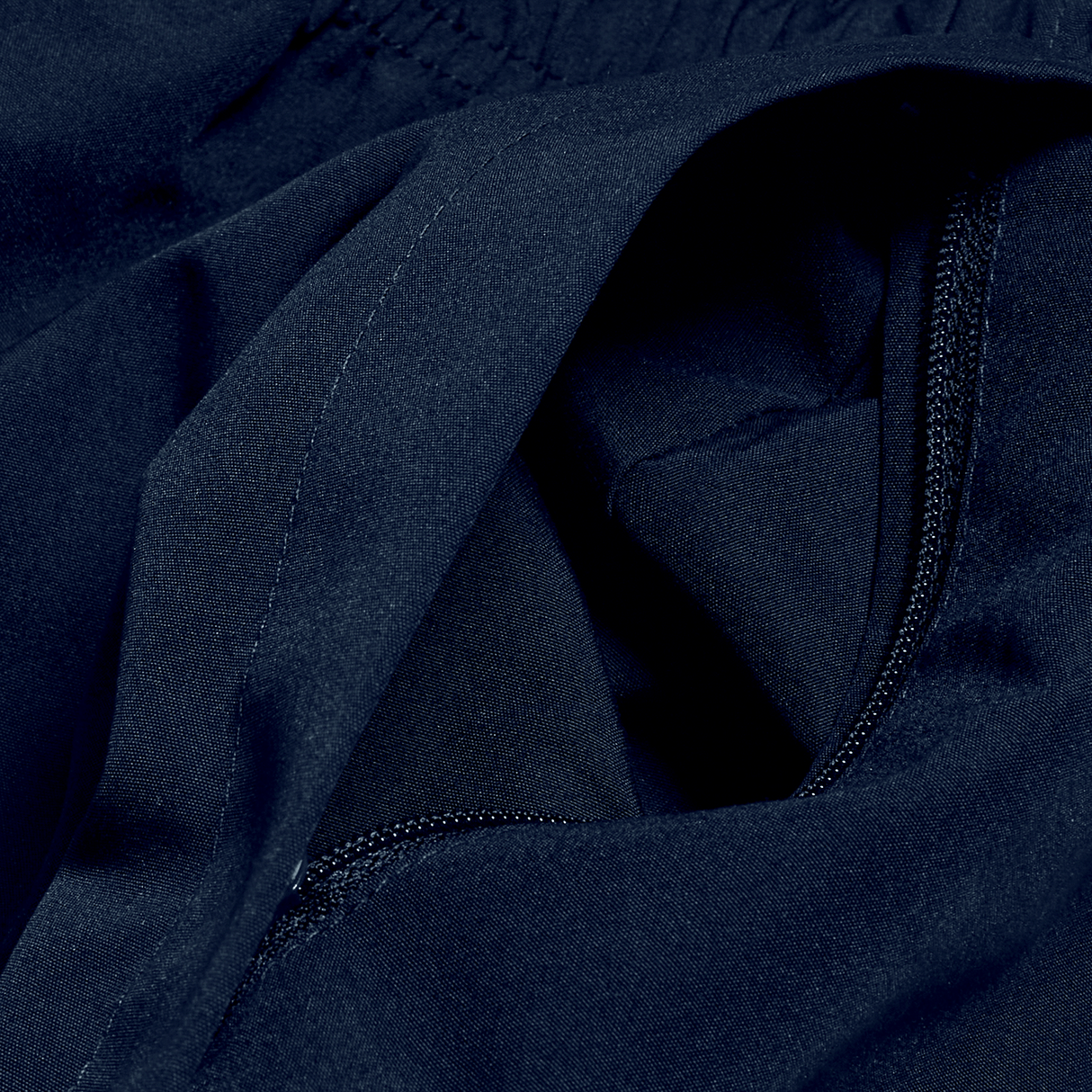 A close up of a Canterbury black jacket with a zipper.