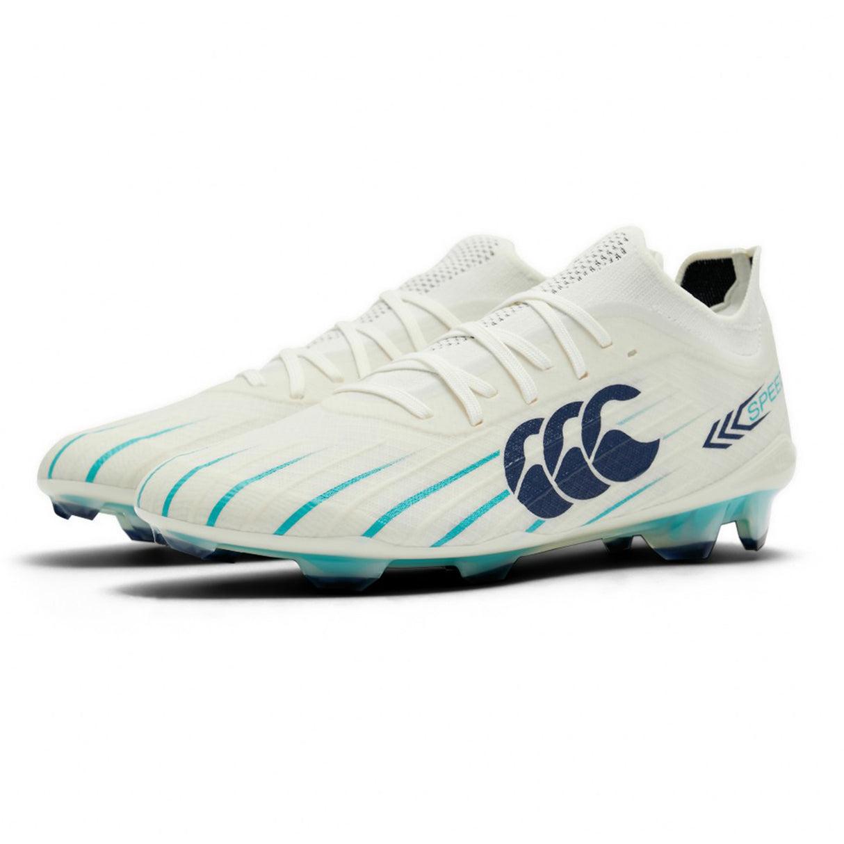 A pair of Canterbury Speed Falcon 2.0 Elite FG rugby cleats in WHITE/BALTIC GREEN, featuring lightweight construction, blue accents, blue Canterbury branding on the sides, and transparent studs tipped in blue.