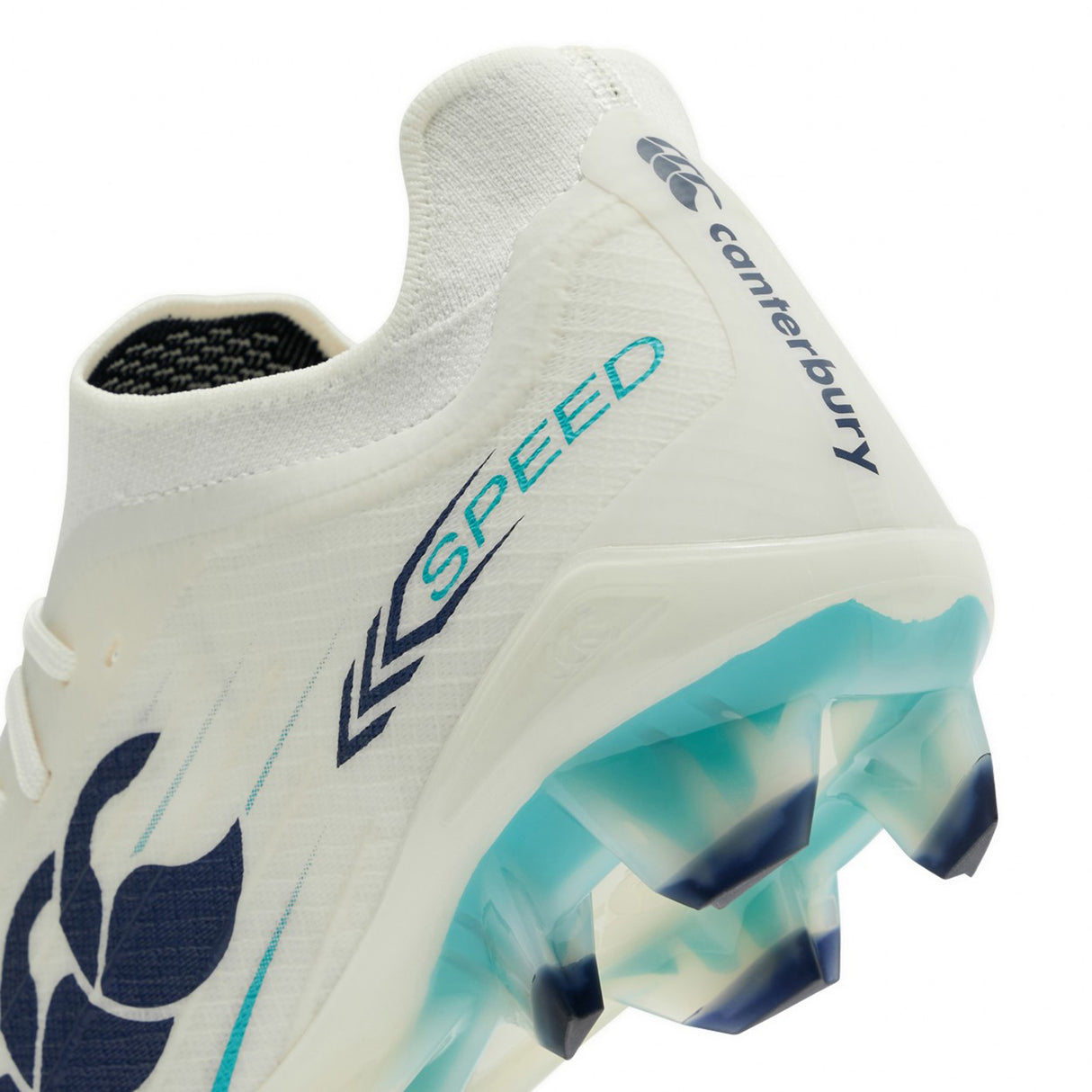 Close-up of the heel and sole of a Canterbury Speed Falcon 2.0 Elite FG rugby boot in WHITE/BALTIC GREEN, highlighting blue-green accents, “SPEED” branding, and a spiked outsole crafted for lightweight performance.