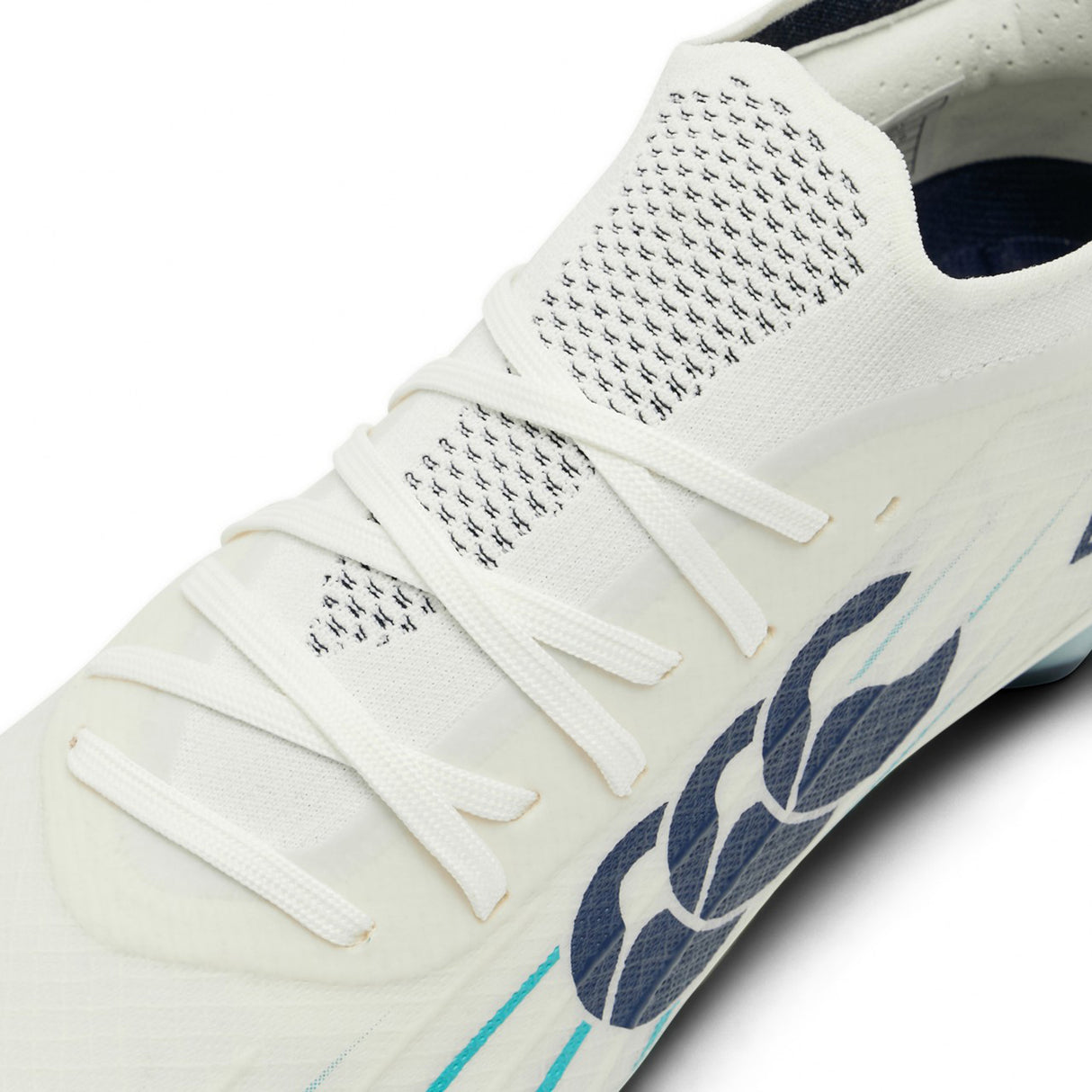 Close-up of the Canterbury Speed Falcon 2.0 Elite FG in WHITE/BALTIC GREEN, a rugby boot by Canterbury featuring white laces, mesh detailing on the tongue, and a Baltic Green design on the side. These lightweight cleats are engineered for speed and agility on the field.