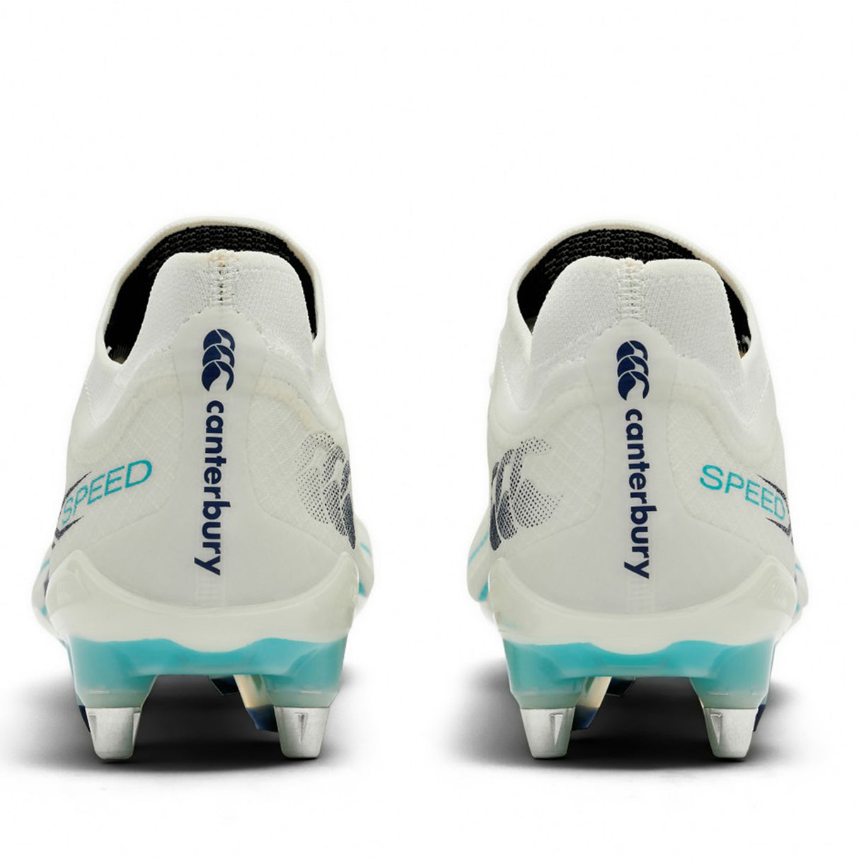 A pair of Canterbury Speed Falcon 2.0 Elite SG rugby boots in WHITE/BALTIC GREEN are shown from the back, featuring metal studs for soft ground, blue Canterbury branding, and “SPEED” text on the heels.