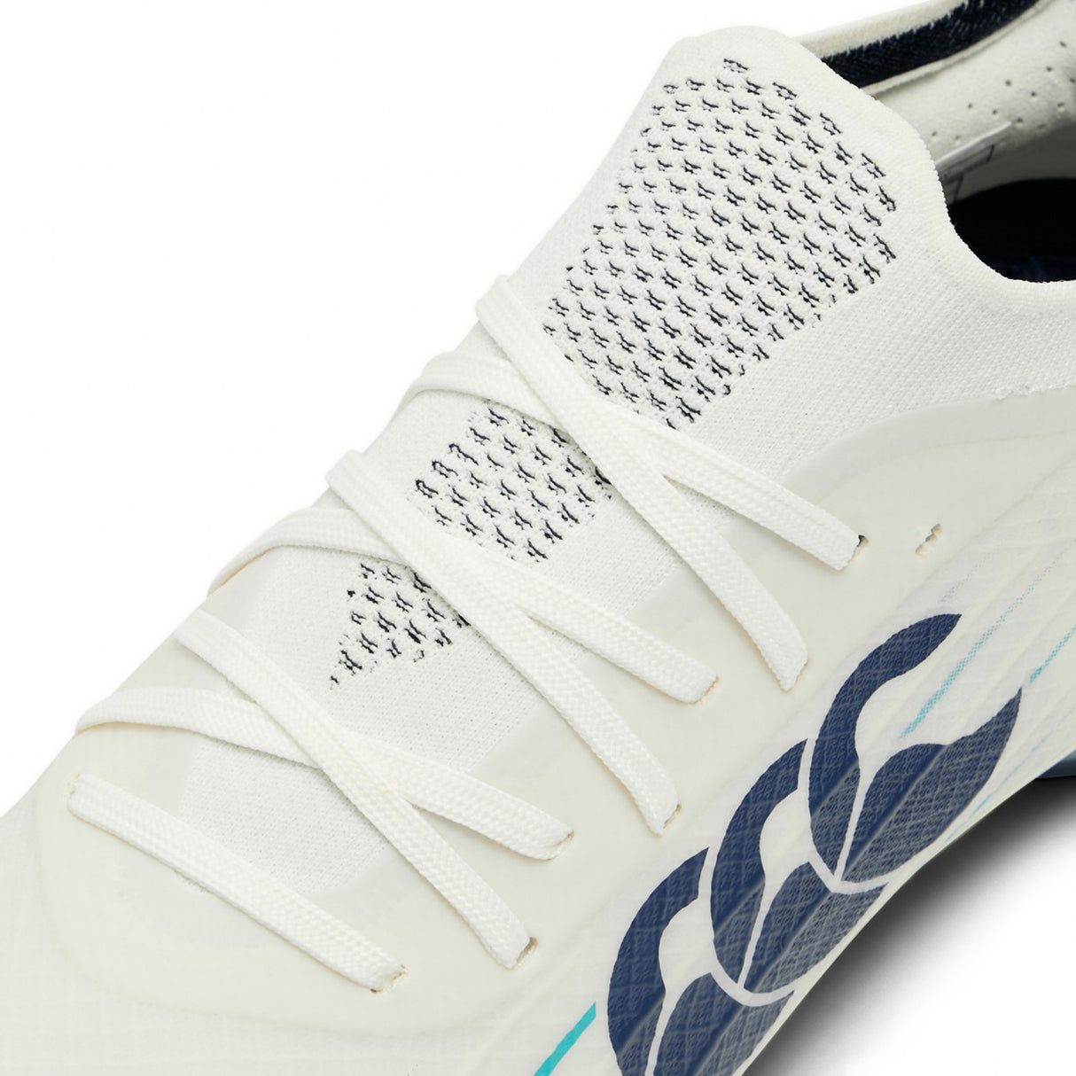 Certainly! Here’s the rewritten sentence using your product data: Close-up of a white Canterbury Speed Falcon 2.0 Elite SG rugby boot with white laces, featuring a Baltic Green logo and black design accents on the upper—these boots are engineered by Canterbury for optimal traction and performance on soft ground.