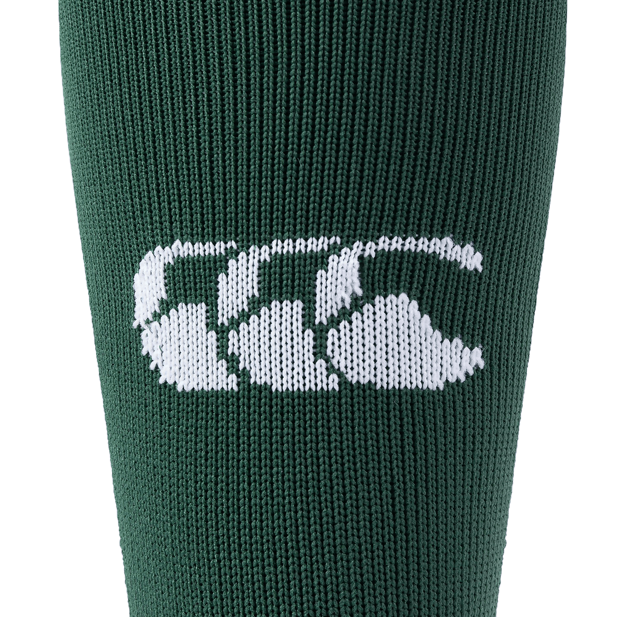 Close-up of the green fabric from a Canterbury Playing Sock, featuring the brand's white CCC logo made up of three interlocking Cs.
