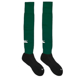 A pair of Canterbury Playing Socks from Canterbury, featuring a cushioned foot bed, black feet, and a white logo near the top in knee-high green.