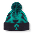 The Ireland 26 Bobble Hat by Canterbury is a green and black knitted acrylic beanie with a black cuff, topped with a pom-pom. It features the IRFU logo—complete with shamrock and rugby ball—embroidered on the front, making it an essential addition to any Ireland Rugby hat collection.