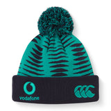 The Ireland 26 Bobble Hat by Canterbury is a stylish green and black knit beanie with a pom-pom, featuring Vodafone and Canterbury logos embroidered on the dark cuff—an essential acrylic hat for every Ireland Rugby fan.