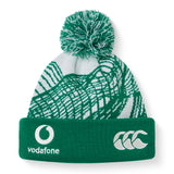 The Ireland 26 Bobble Hat by Canterbury is a green and white knit beanie with a pom-pom, featuring Vodafone and CCC logos on the front fold—perfect for any Ireland Rugby fan.