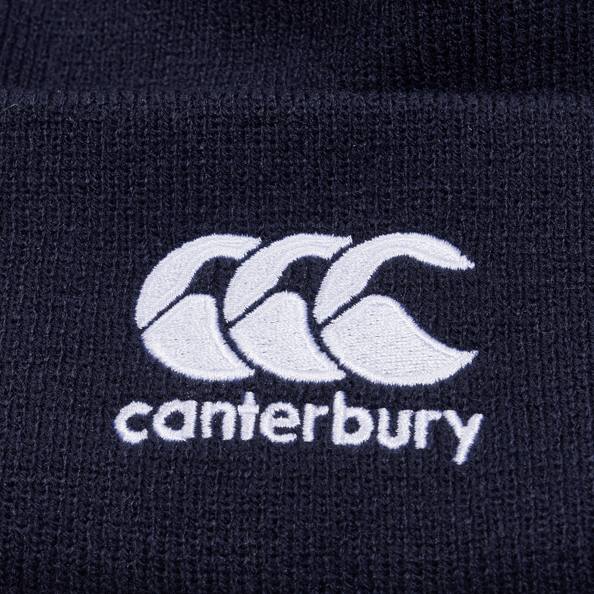 Navy knit beanie with white CCC logo on cuff.