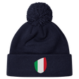The newly released navy blue Italy Shield Pom Pom Beanie from EMB Canterbury features a striking shield emblem on the front.
