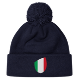 The newly released navy blue Italy Shield Pom Pom Beanie from EMB Canterbury features a striking shield emblem on the front.