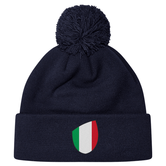 The newly released navy blue Italy Shield Pom Pom Beanie from EMB Canterbury features a striking shield emblem on the front.
