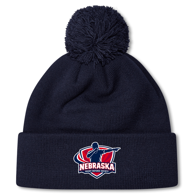 Stay warm at the match with the Nebraska Rugby Referee Society Pom Pom Beanie by EMB Canterbury, featuring a navy design, pom-pom top, and front logo patch.