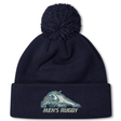Navy blue University of New Hampshire Pom Pom Beanie by Canterbury, featuring a wildcat mascot logo and “MEN’S RUGBY” text on the cuff.