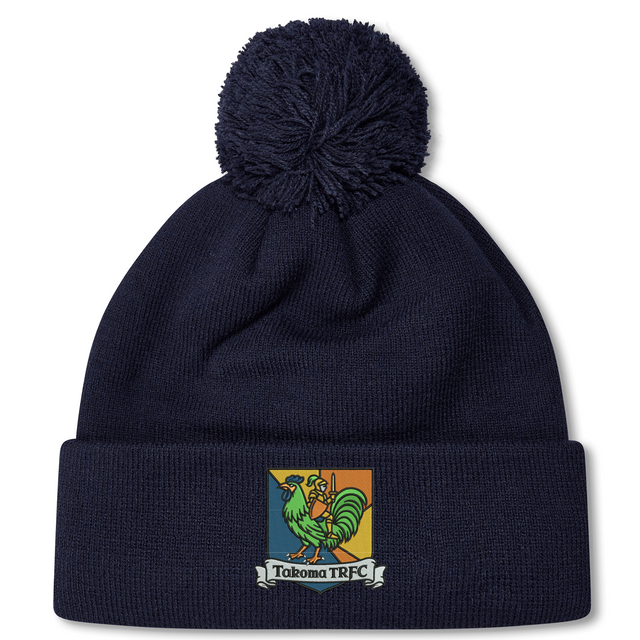 Navy blue fleece-lined Takoma Touch Rugby Pom Pom Beanie featuring an embroidered emblem of a green rooster in armor above a banner that reads “Takoma TRFC.”