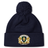 The Old Man Rivah Rugby Pom Pom Beanie by EMB Canterbury is a navy blue beanie with a pom-pom, featuring a crest on the cuff with "Old Man Rivah," "Sor Quam Glodic," and lion designs.