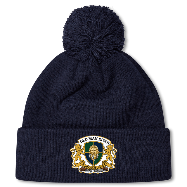 The Old Man Rivah Rugby Pom Pom Beanie by EMB Canterbury is a navy blue beanie with a pom-pom, featuring a crest on the cuff with "Old Man Rivah," "Sor Quam Glodic," and lion designs.