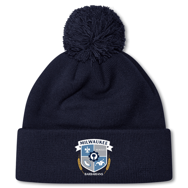 The Milwaukee Barbarians Rugby Pom Pom Beanie by EMB Canterbury is a navy blue rugby beanie with a pom-pom and features a Milwaukee Barbarians logo patch on the front cuff.