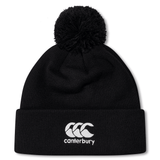 The South Africa Shield Pom Pom Beanie by EMB Canterbury is a black beanie with a pom-pom and features the white Canterbury logo on the cuff, designed to keep you warm. Ideal for fans supporting South Africa.