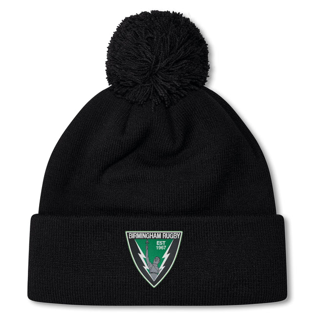 The Birmingham Rugby Pom Pom Beanie by EMB Canterbury is a black knit beanie with a pom-pom, fleece lining for warmth, and features a Birmingham Rugby patch on the front cuff.