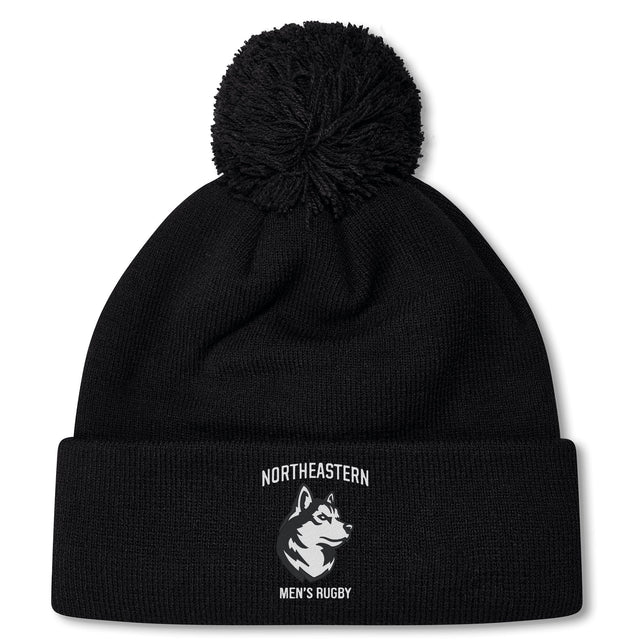 Stay warm in the Northeastern University Men's Rugby Pom Pom Beanie by EMB Canterbury, featuring a husky logo and "NORTHEASTERN MEN'S RUGBY" on the cuff. Cozy fleece lining adds extra warmth.