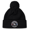 Stay warm in the EMB Canterbury Mudsock Rugby Pom Pom Beanie—a fleece-lined black knit beanie with a classic rugby bobble hat style and front “Mudsock Youth Rugby” patch.