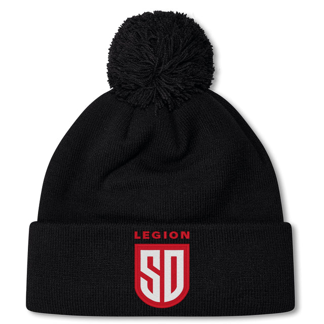 Stay warm in the San Diego Legion Rugby Academy Pom Pom Beanie by EMB Canterbury, featuring a black knit design, fleece lining, and "LEGION SD" in red and white on the front cuff.