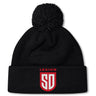 Stay warm in the San Diego Legion Rugby Academy Pom Pom Beanie by EMB Canterbury, featuring a black knit design, fleece lining, and "LEGION SD" in red and white on the front cuff.