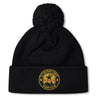 The Pittsburgh Forge Pom Pom Beanie by Canterbury features a black knit design, cuff logo patch, and pom-pom on top—an EMB Canterbury custom rugby hat inspired by the classic Canterbury Rugby Beanie style.