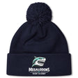 Stay warm with the EMB Canterbury NC Rugby Academy - Megalodons Pom Pom Beanie, a navy fleece-lined hat featuring a pom-pom, embroidered shark logo, and "Megalodons NC Rugby Academy" text on the front.