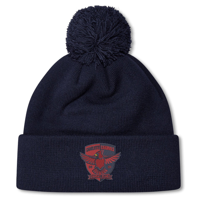 Stay warm with the Charlotte Cardinals Rugby Club Pom Pom Beanie by Canterbury—navy blue, fleece-lined, with a red club logo on the front cuff. The perfect rugby bobble hat from EMB Canterbury.