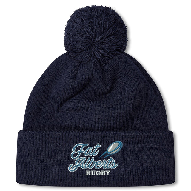 Stay warm in the fleece-lined Gulf Coast Fat Alberts Pom Pom Beanie by EMB Canterbury, featuring "Fat Alberts Rugby" and a rugby ball graphic embroidered on the front cuff. Navy blue knit with classic pom-pom for added style.
