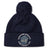 The Georgetown University RFC Pom Pom Beanie by Canterbury features a navy blue knit, fleece lining, pom-pom, bulldog graphic, and club logo—a perfect rugby fan hat from EMB Canterbury.