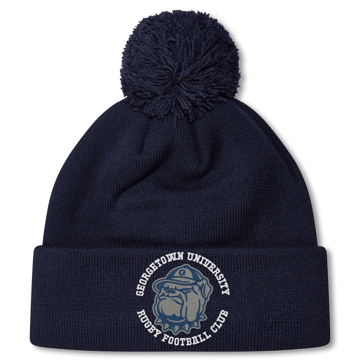 The Georgetown University RFC Pom Pom Beanie by Canterbury features a navy blue knit, fleece lining, pom-pom, bulldog graphic, and club logo—a perfect rugby fan hat from EMB Canterbury.