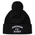 The Birmingham Rugby Text Logo Pom Pom Beanie by Canterbury from EMB Canterbury is a black knit, fleece-lined beanie with a pom-pom on top, featuring “Birmingham Rugby” and a small graphic embroidered in white on the front cuff.