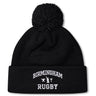 The Birmingham Rugby Text Logo Pom Pom Beanie by Canterbury from EMB Canterbury is a black knit, fleece-lined beanie with a pom-pom on top, featuring “Birmingham Rugby” and a small graphic embroidered in white on the front cuff.