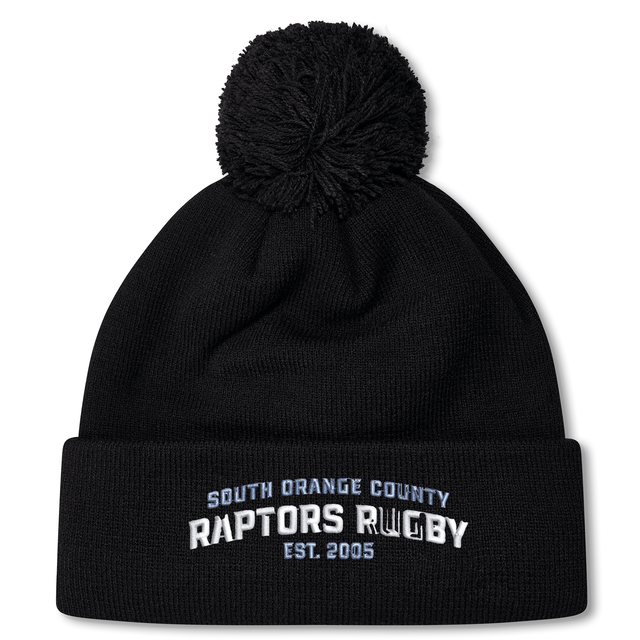 Stay warm and showcase your team spirit with the South Orange County Raptors Pom Pom Beanie by Canterbury. This cozy black knit beanie from EMB Canterbury features a classic pom-pom on top and white and blue embroidered text reading “South Orange County Raptors Rugby Est. 2005.”.