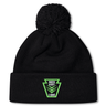 Black Rock Rugby Pom Pom Beanie by Canterbury with a matching pom-pom and a green “ROCK RUGBY LIONS” patch on the front.