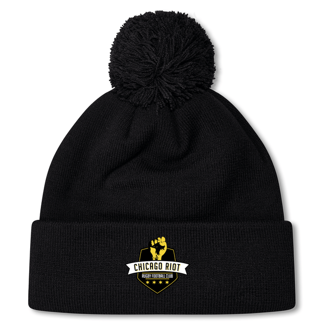 Stay warm in style with the Chicago Riot Pom Pom Beanie by EMB Canterbury, featuring a fleece lining and a gold and white "Chicago Riot Rugby Football Club" logo embroidered on the front. Perfect for sporty winter outfits.