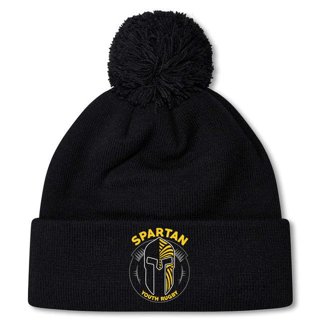 The Spartan Youth Rugby Pom Pom Beanie by EMB Canterbury features a black design with a pom-pom, fleece lining, and a Spartan helmet logo on the cuff—perfect for keeping rugby fans warm and stylish.