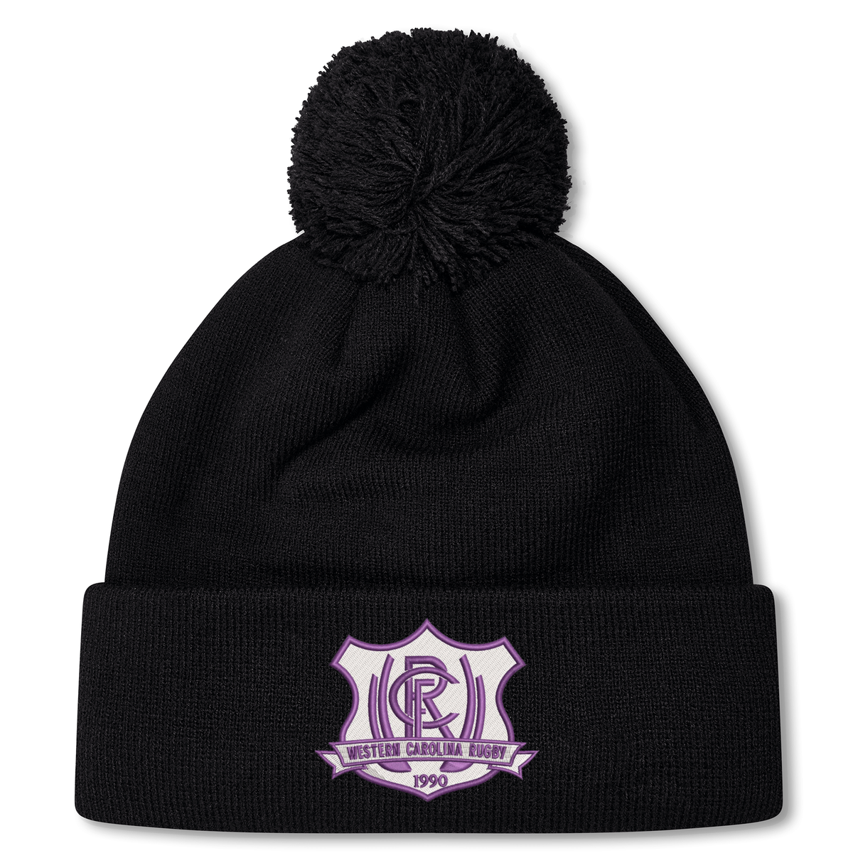 Black knit Western Carolina University Pom Pom Beanie by Canterbury featuring a Western Carolina Rugby emblem on the cuff and a pom-pom topper.