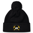 Mother Lode Pom Pom Beanie by Canterbury in black, featuring a pom-pom and an embroidered emblem of crossed yellow pickaxes and a rugby ball.
