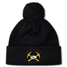 Mother Lode Pom Pom Beanie by Canterbury in black, featuring a pom-pom and an embroidered emblem of crossed yellow pickaxes and a rugby ball.