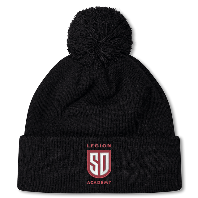 Black fleece-lined Legion Academy Pom Pom Beanie by Canterbury featuring a pom-pom on top and a shield-shaped logo with the letters “SD,” “LEGION” above, and “ACADEMY” below.