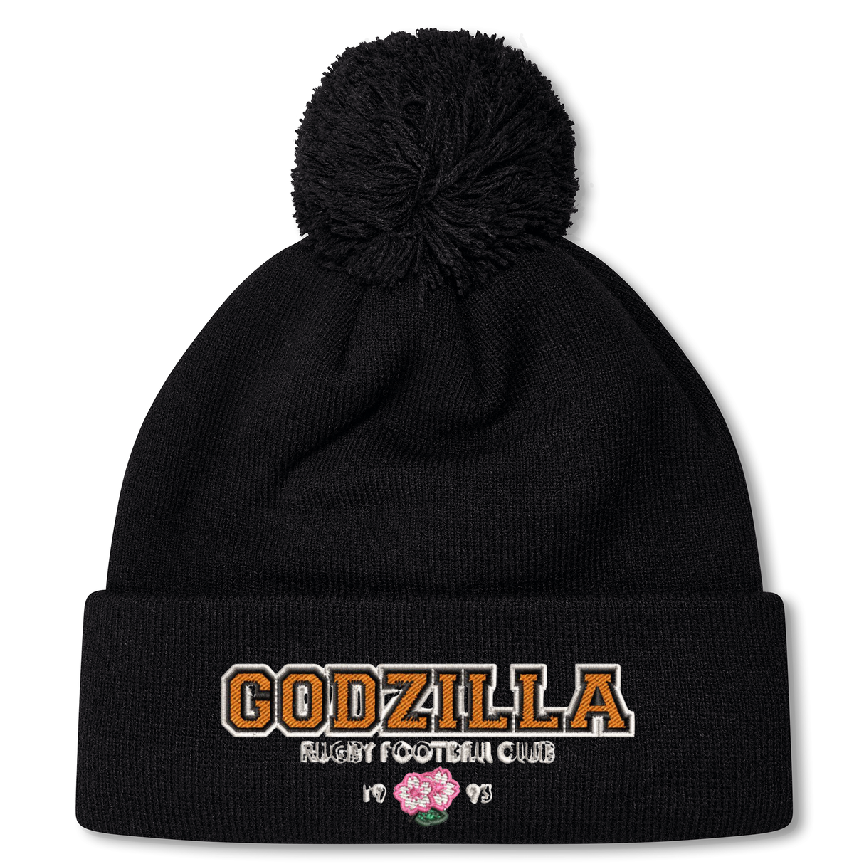 The Godzilla Rugby Football Club Pom Pom Beanie by Canterbury from EMB Canterbury is a black knit beanie with a pom-pom, featuring “GODZILLA RUGBY FOOTBALL CLUB” text and a pink embroidered flower on the front. Cozy fleece lining provides warmth and style for dedicated fans.