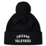 The Chicago Valkyries Pom Pom Beanie by EMB Canterbury is a black knit hat featuring a classic pom-pom on top and "CHICAGO VALKYRIES" embroidered in bold white capital letters on the folded brim. This Canterbury rugby bobble hat is perfect for staying warm at matches or around town.