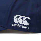 Close-up of the Fiji Shield Flex Drill Cap by EMB Canterbury, showcasing a navy blue cap with the white embroidered logo and text, accentuated by a detailed Fiji Shield design.