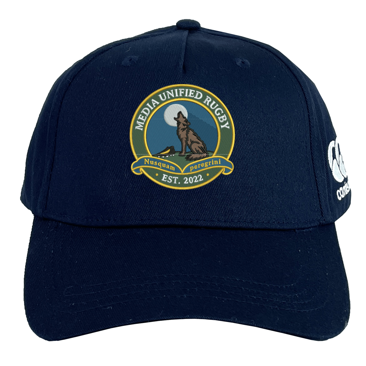 Dark blue Media Unified Rugby Flexfit Drill Cap by Canterbury featuring a circular embroidered patch of a howling wolf before a full moon, with the text “Media Unified Rugby” and “Est. 2022.”