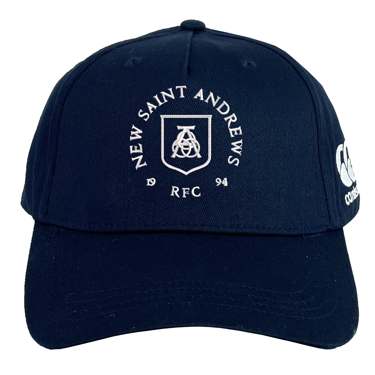 The New Saint Andrews College Flexfit Drill Cap by EMB Canterbury is a navy blue cap featuring “New Saint Andrews RFC 1994” and a logo printed in white on the front, an embroidered Canterbury logo on the left side, and a comfortable flex fit design.