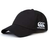 A black World Rugby Shop Flexfit Drill Cap by Canterbury with a curved brim, featuring an embroidered "Canterbury" and a triple "C" logo in white on the front side by EMB Canterbury.