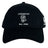 The Amoskeag Rugby Club Flexfit Drill Cap by EMB Canterbury features a black design with a white ram's head logo and "AMOSKEAG Est. 1984" embroidered on the front, offering a stylish custom cap for everyday wear.